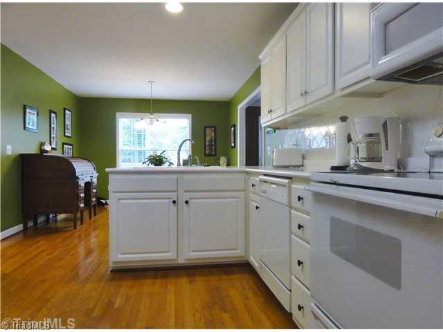411 Walnut Grove Road Archdale, NC 27263 - Photo 7 of 16 Kitchen. Galley kitchen is the center of the home