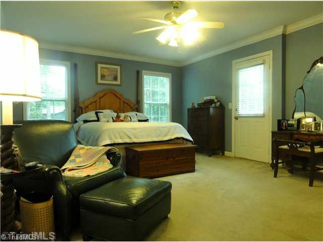 411 Walnut Grove Road Archdale, NC 27263 - Photo 10 of 16 Master Bedroom. Plenty of room for large furniture and has access to the deck for that morning cup of coffee in the fresh air