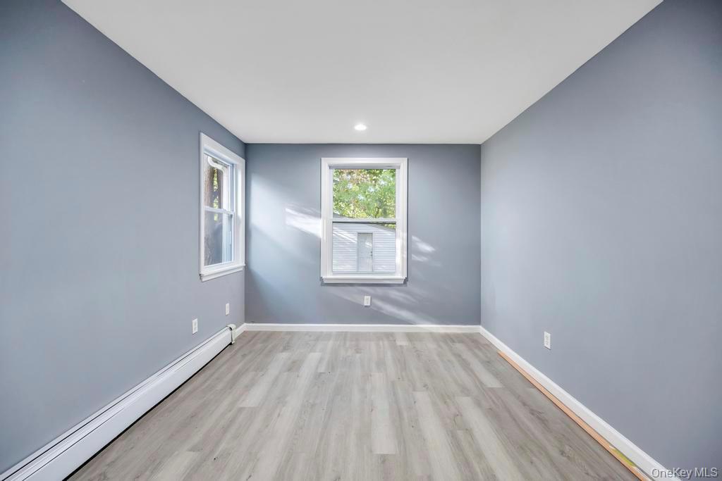231 Elm Road West Mastic Beach, NY 11951 - Photo 25 of 34 a view of room with window and hardwood floor