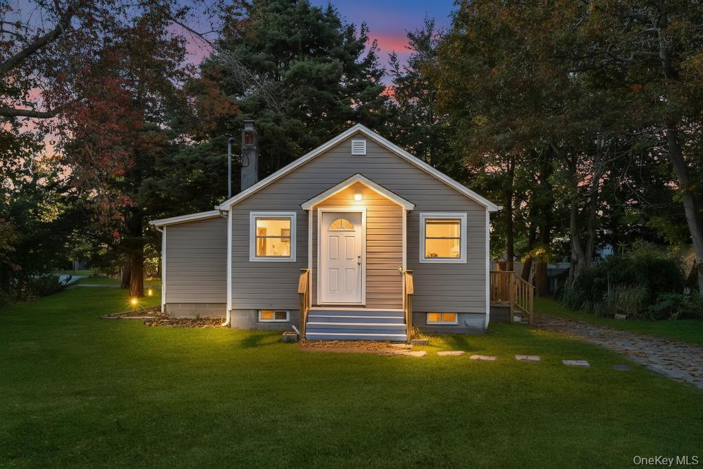 231 Elm Road West Mastic Beach, NY 11951 - Photo 4 of 34 a house view with a garden space