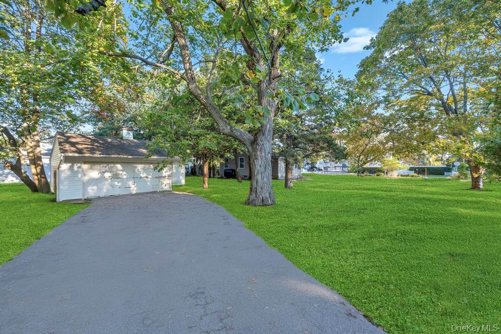 231 Elm Road West Mastic Beach, NY 11951 - Photo 8 of 34 a view of a park with tree s