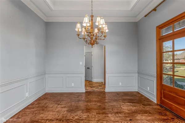 a view of entryway with window and wooden floor