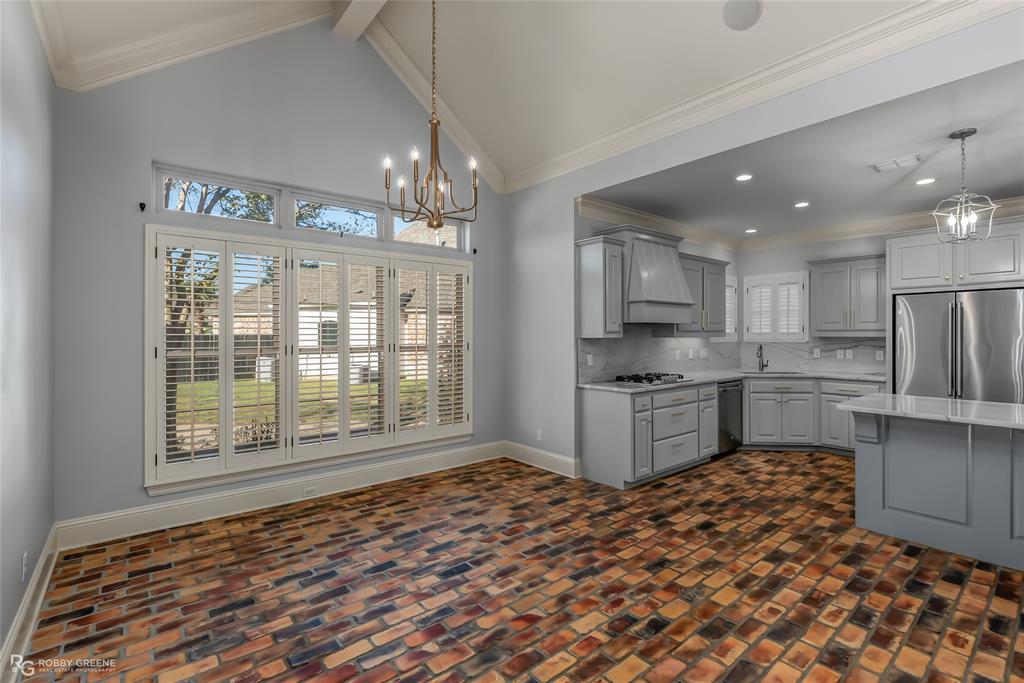 1012 Conti Circle Shreveport, LA 71106 - Photo 19 of 40 a kitchen with stainless steel appliances granite countertop a refrigerator and a stove top oven