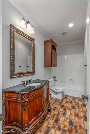 a bathroom with a sink a mirror and a bathtub