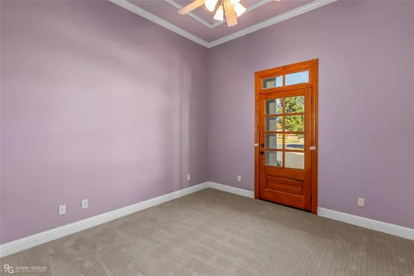 an empty room with a fireplace and a window