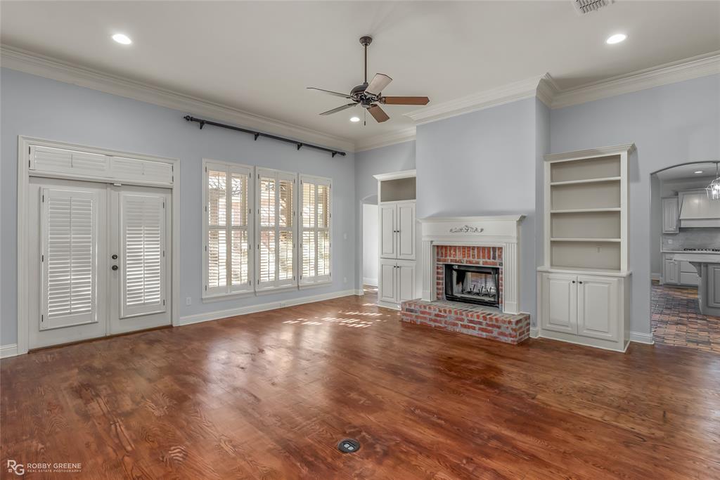 1012 Conti Circle Shreveport, LA 71106 - Photo 8 of 40 a view of an empty room with a fireplace and a window