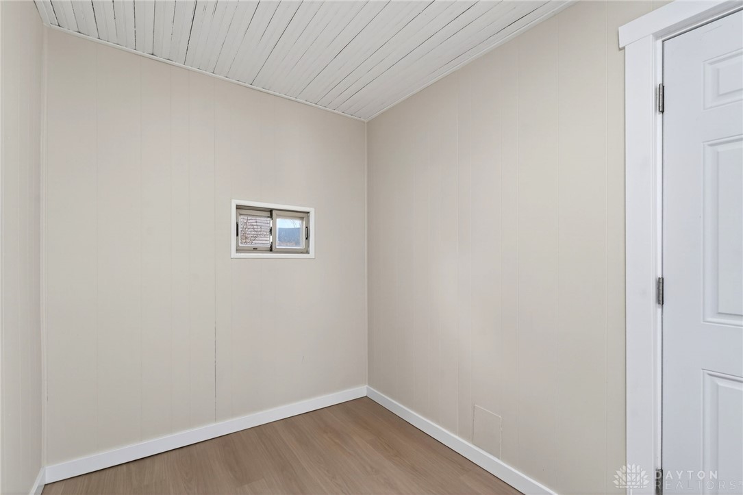 585 North Spring Street Wilmington, OH 45177 - Photo 12 of 21 This cozy, versatile space features a window, providing natural light, and durable flooring.