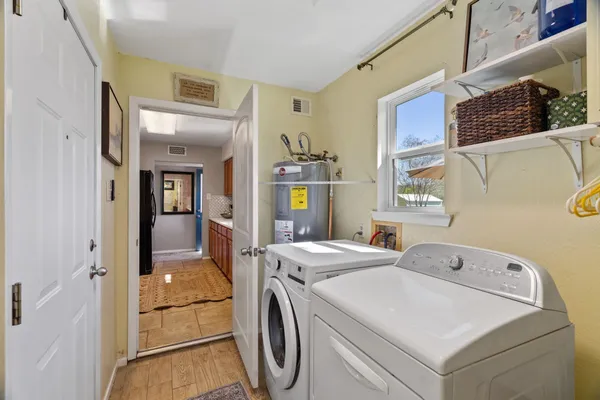 a utility room with dryer and washer