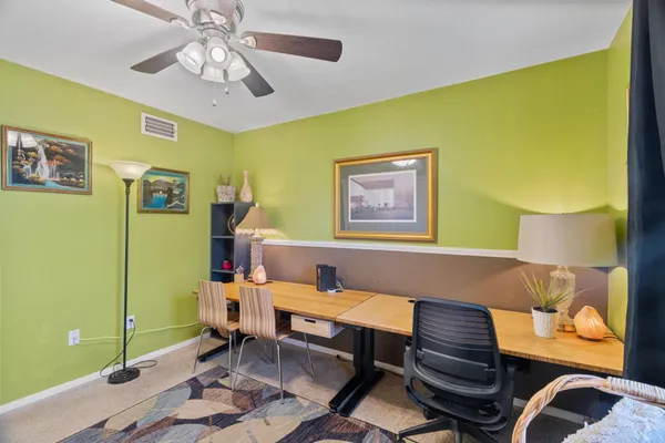 a living room with furniture and a table