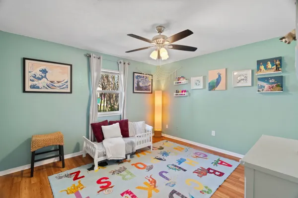 a bedroom with a bed and furniture