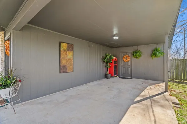 a bed room with a bed and a potted plant