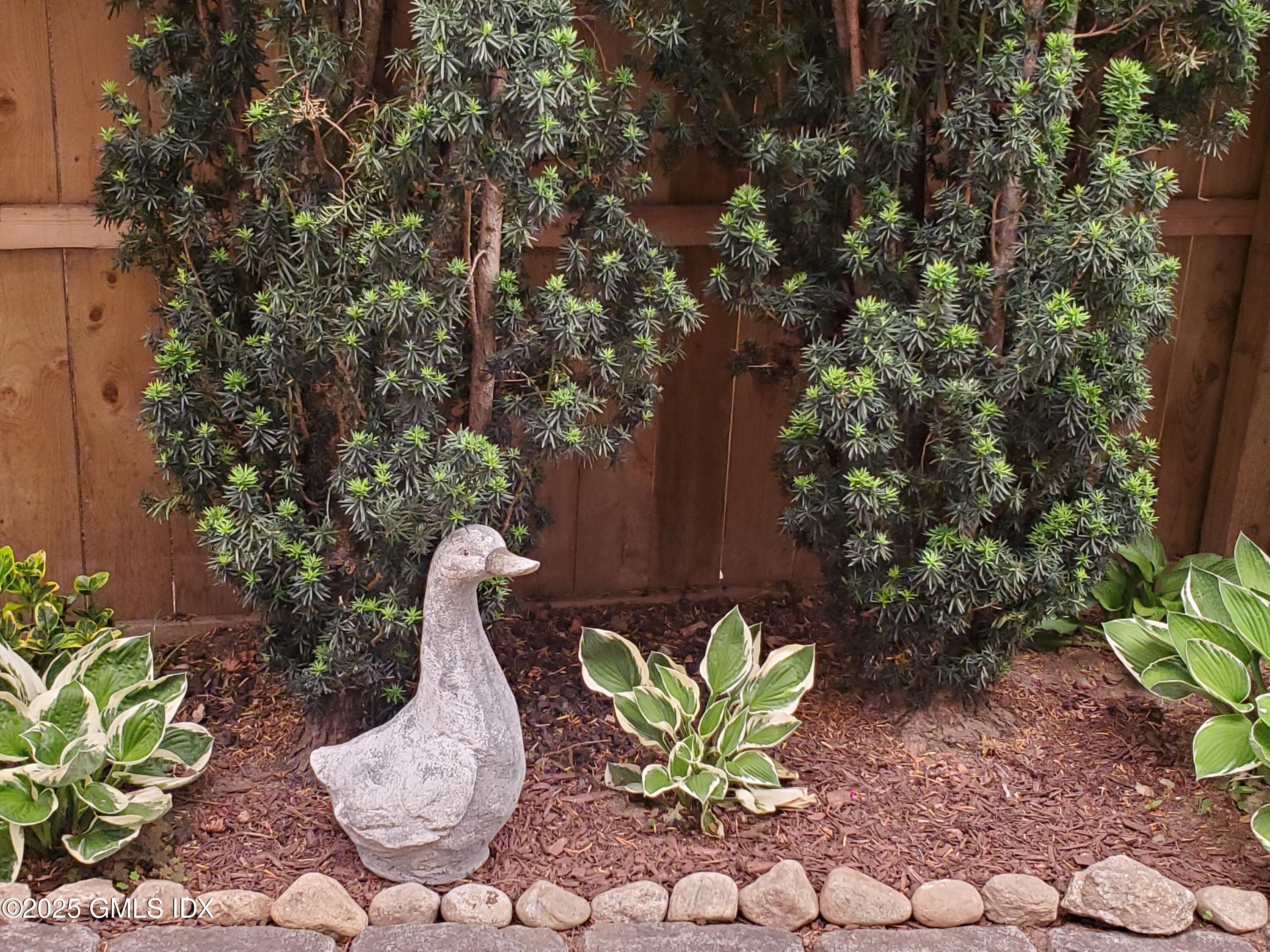 92 Valley Road, Unit B Cos Cob, CT 06807 - Photo 30 of 46 a view of a chairs in a backyard