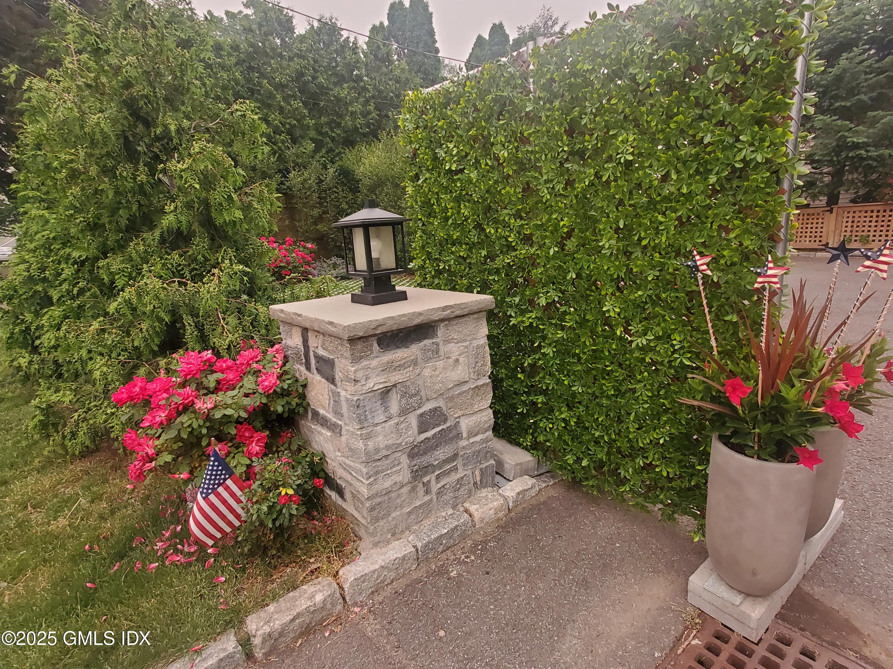 92 Valley Road, Unit B Cos Cob, CT 06807 - Photo 37 of 46 a front view of a house with a yard