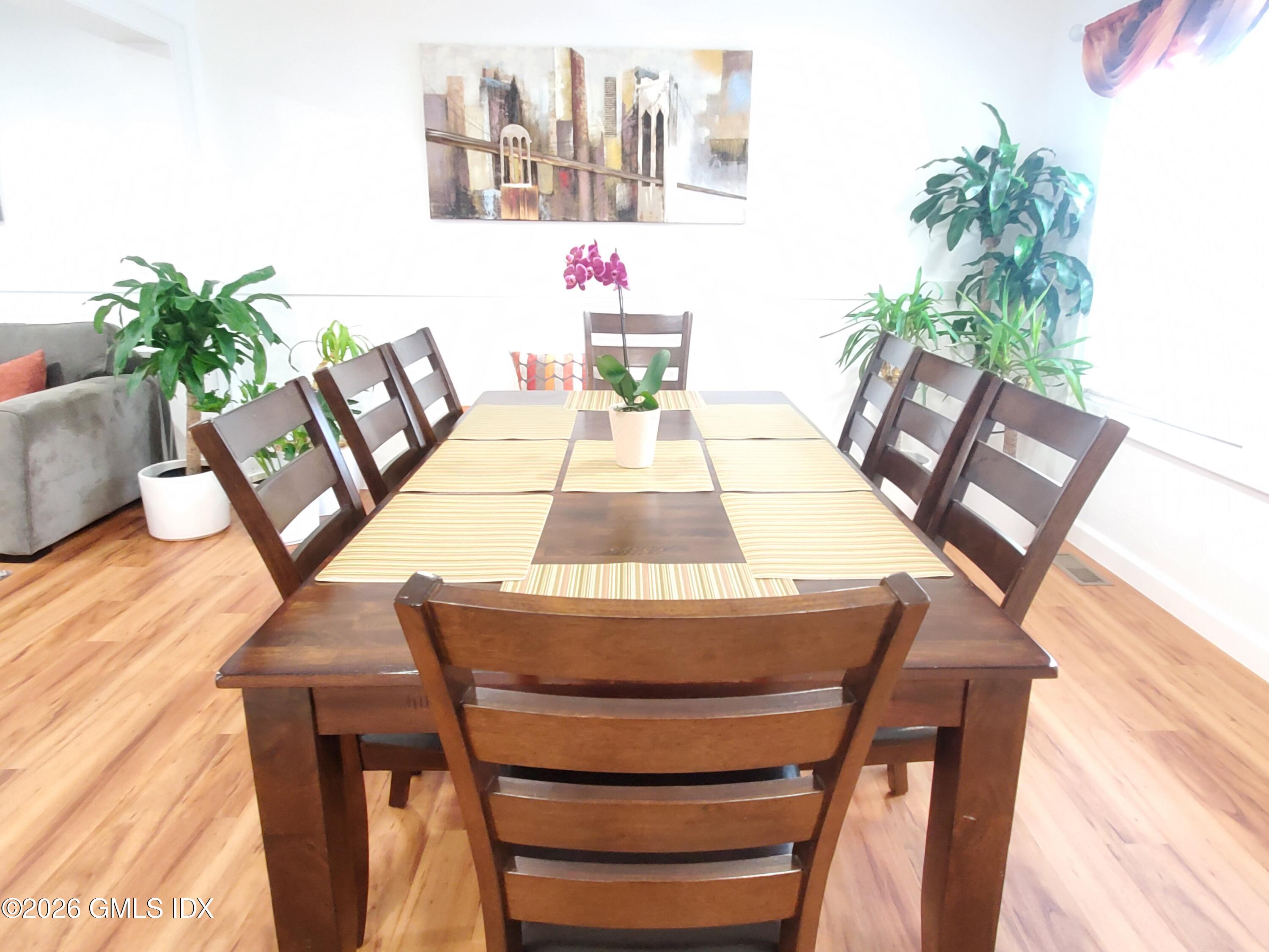 92 Valley Road, Unit B Cos Cob, CT 06807 - Photo 4 of 46 a dining room with furniture and wooden floor