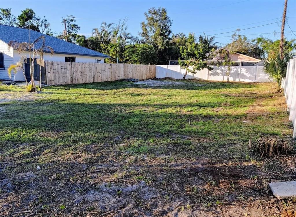 0 Benson Street Sarasota, FL 34231 - Photo 2 of 12 a view of a house with a yard
