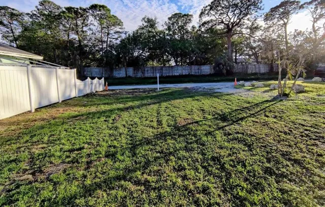 a backyard of a house with lots of green space