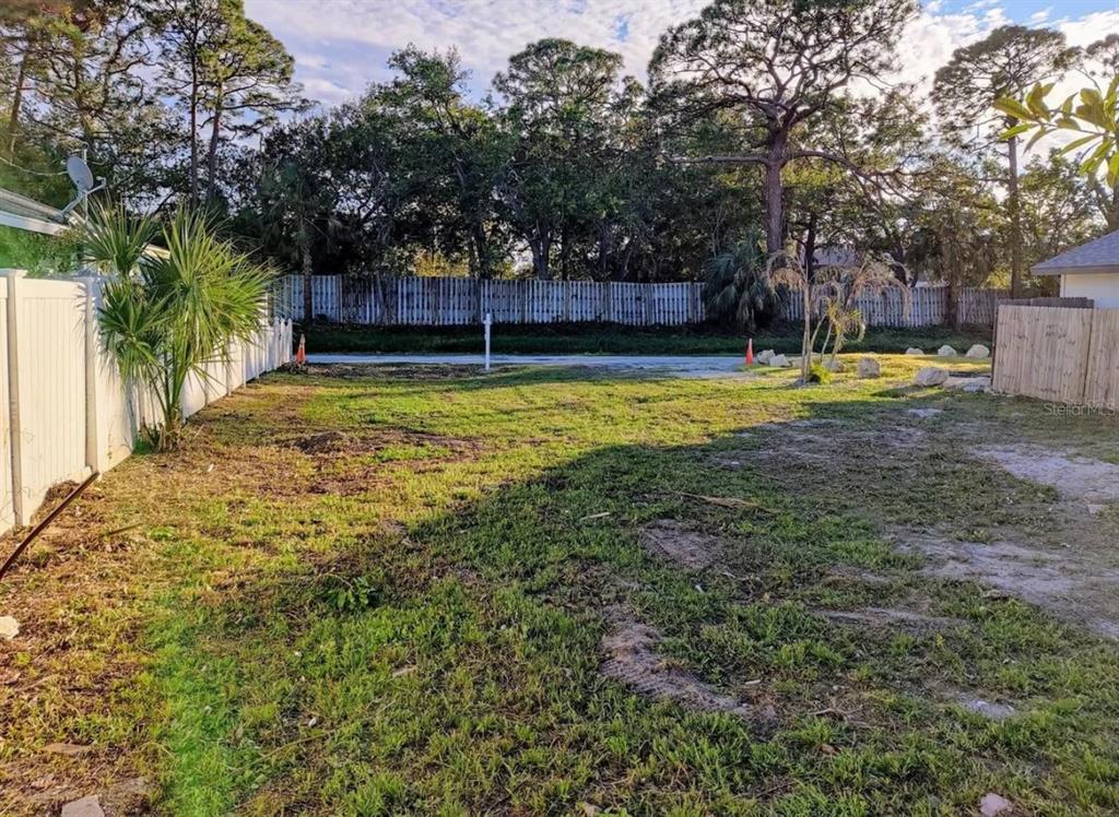 0 Benson Street Sarasota, FL 34231 - Photo 7 of 12 a view of yard with swimming pool and trees