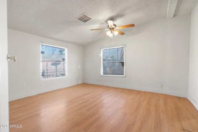 a backyard of a house with lots of green space