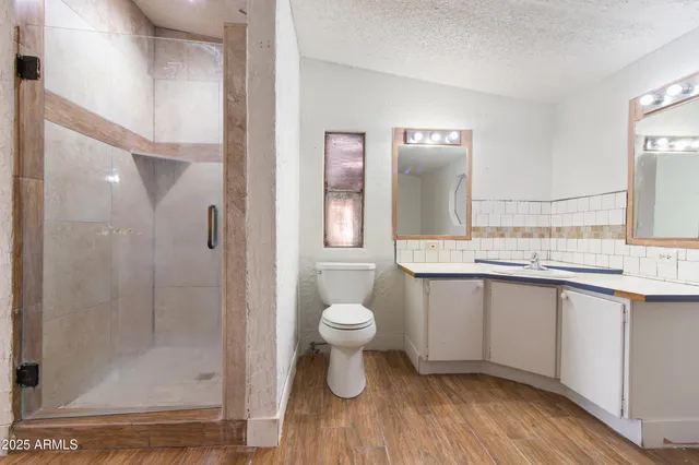 a view of a street with palm trees