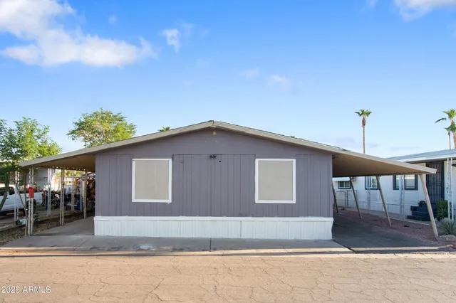 a view of a kitchen with a sink and a refrigerator