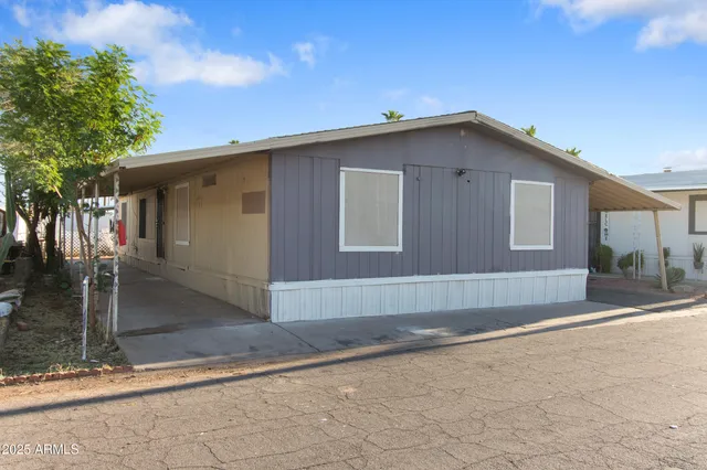 a kitchen with white cabinets and appliances