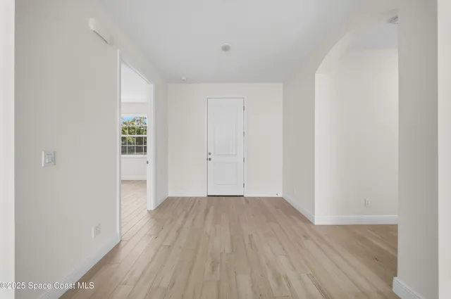 a view of wooden floor in an empty room