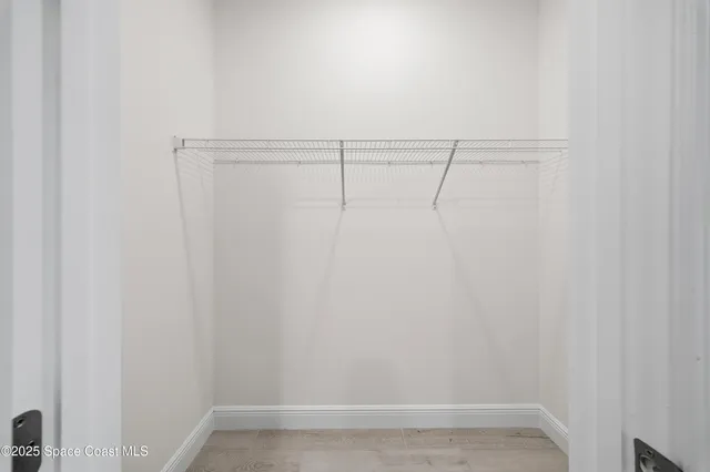 a view of a room with racks on the wall