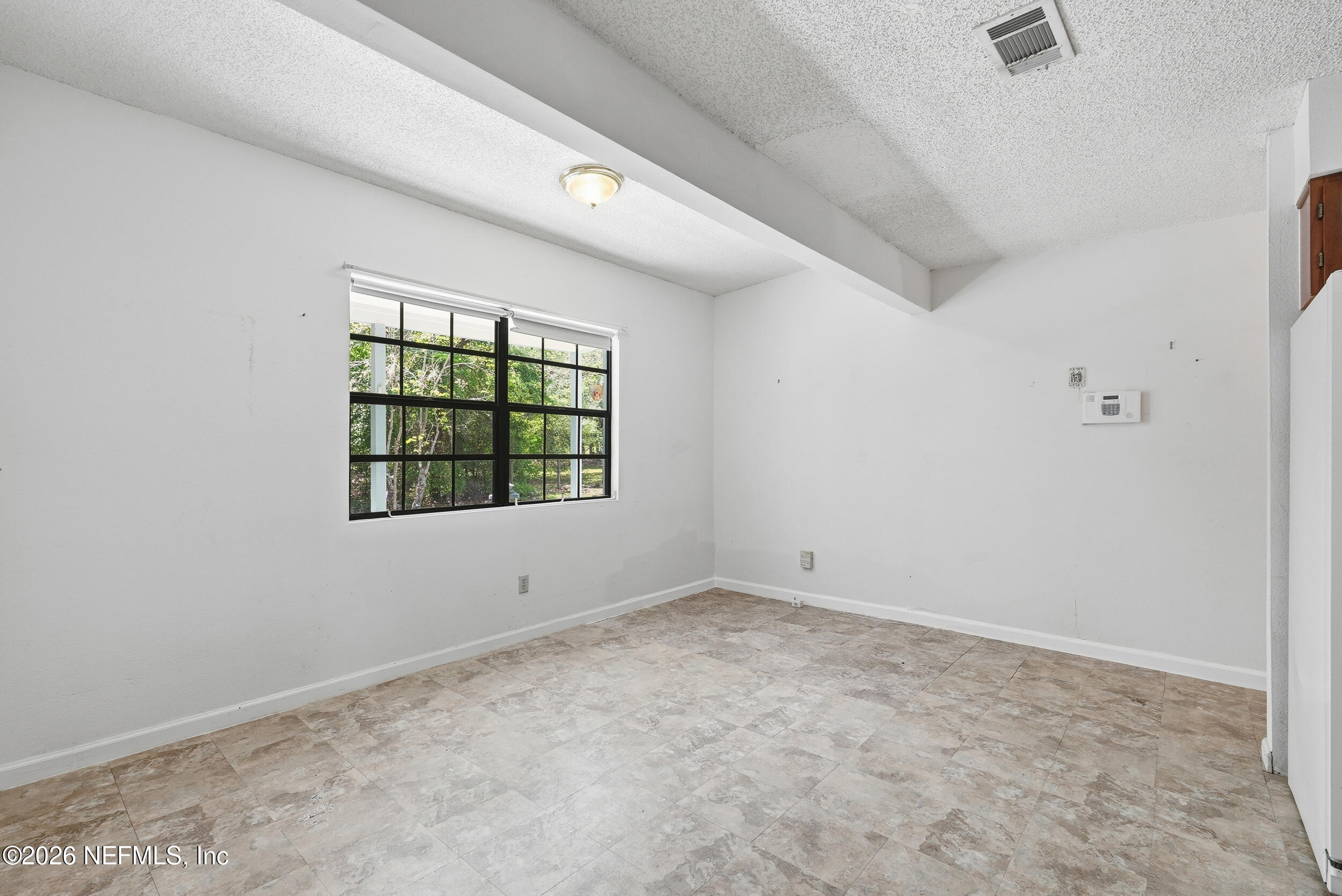 7593 Silver Sands Road Keystone Heights, FL 32656 - Photo 14 of 36 an empty room with windows