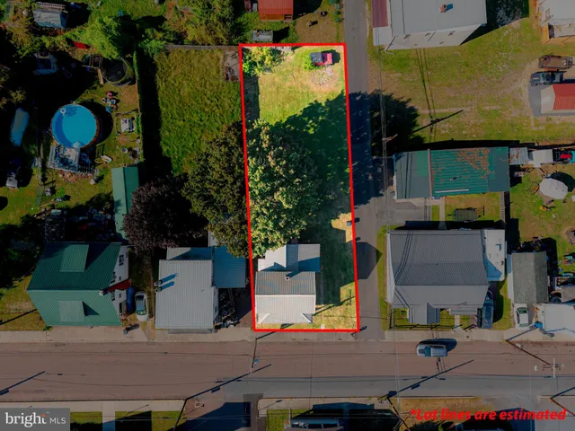 an aerial view of houses with yard