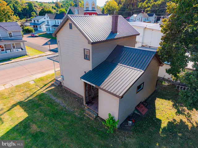 a view of backyard with swimming pool