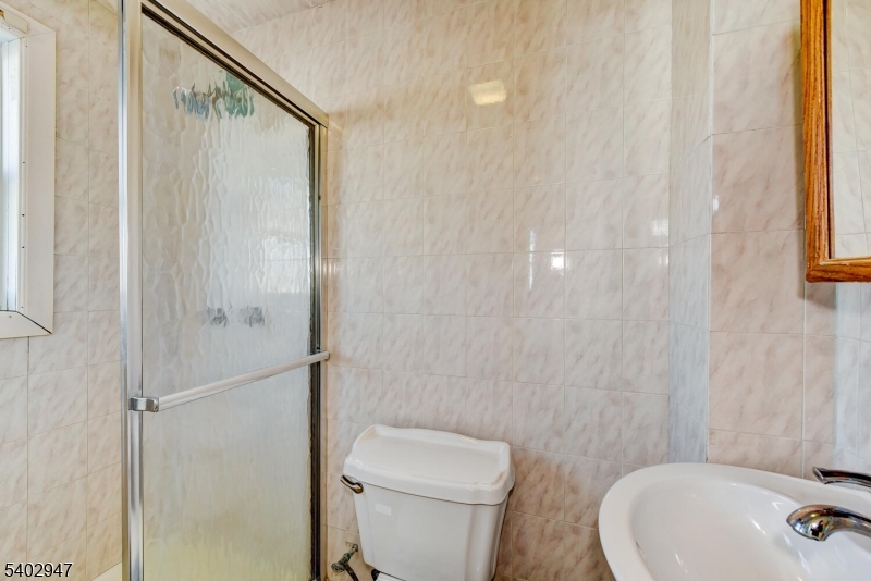 946 West 7th Street, Unit 1 Plainfield, NJ 07063 - Photo 14 of 14 a bathroom with a toilet and a sink