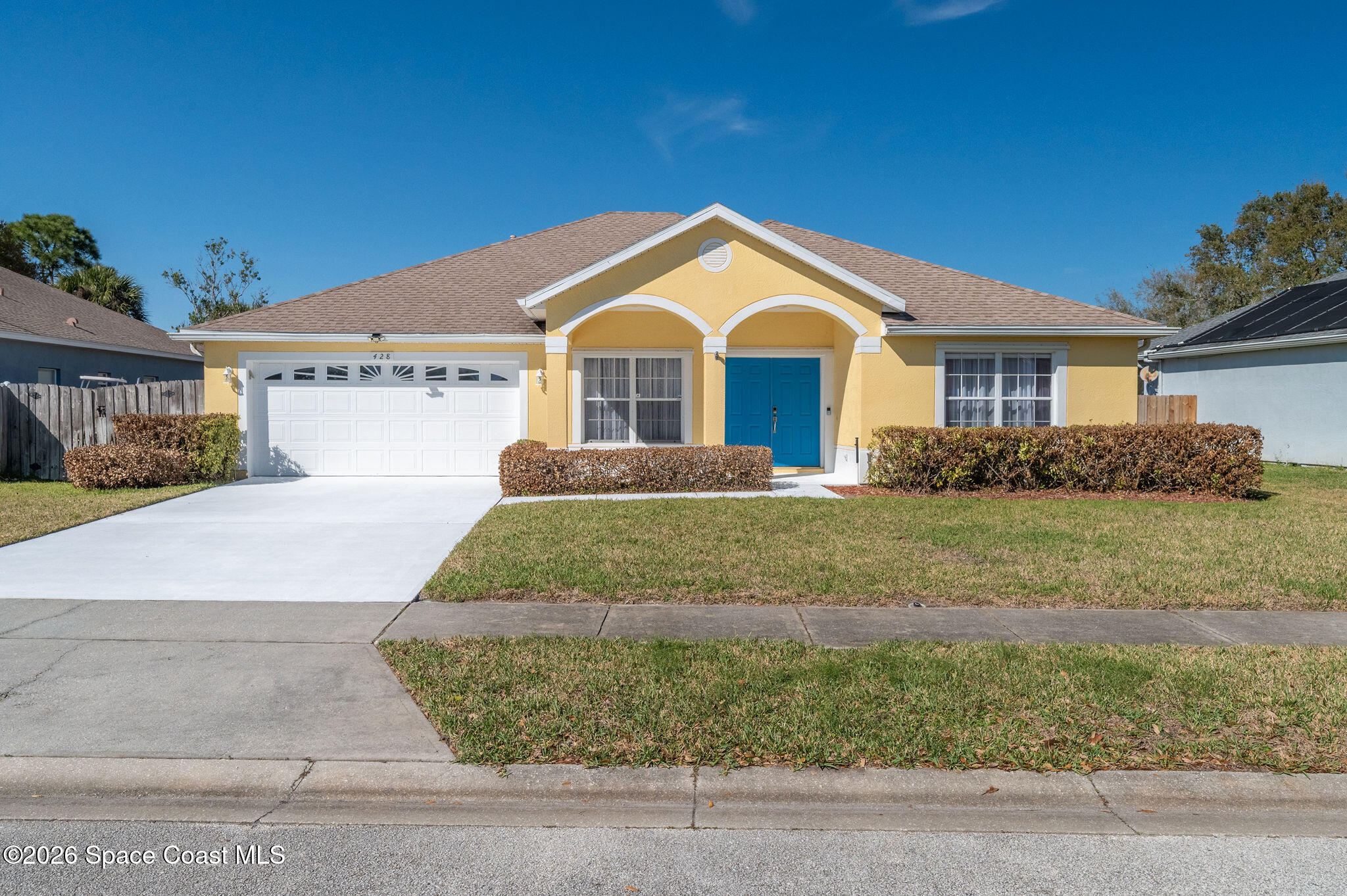 a front view of a house with garage