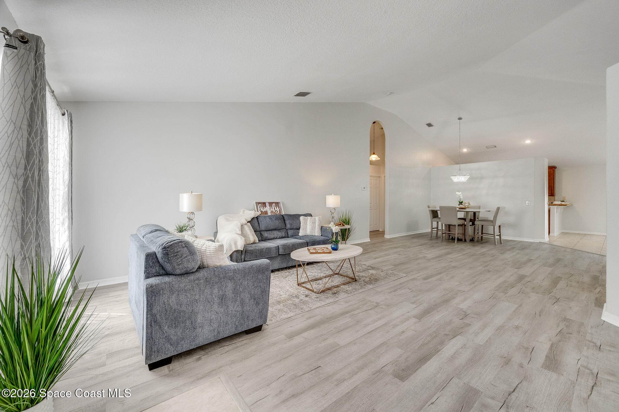 428 Wenthrop Circle Rockledge, FL 32955 - Photo 11 of 58 a living room with furniture and a large window