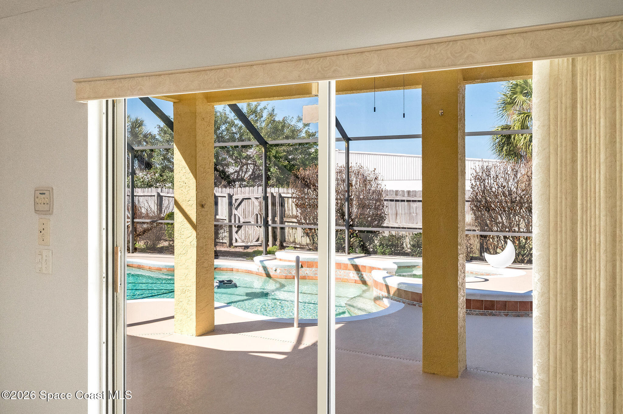 428 Wenthrop Circle Rockledge, FL 32955 - Photo 26 of 58 a living room with a large window and floor to ceiling window