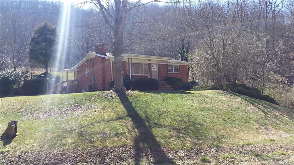 502 Wilson Cove Road Canton, NC 28716 - Photo 1 of 18 a view of a yard in front of a house