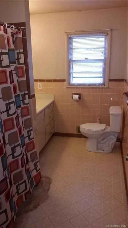 502 Wilson Cove Road Canton, NC 28716 - Photo 16 of 18 a bathroom with a toilet and a shower