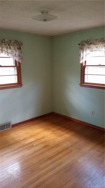 502 Wilson Cove Road Canton, NC 28716 - Photo 17 of 18 a view of an empty room with a window