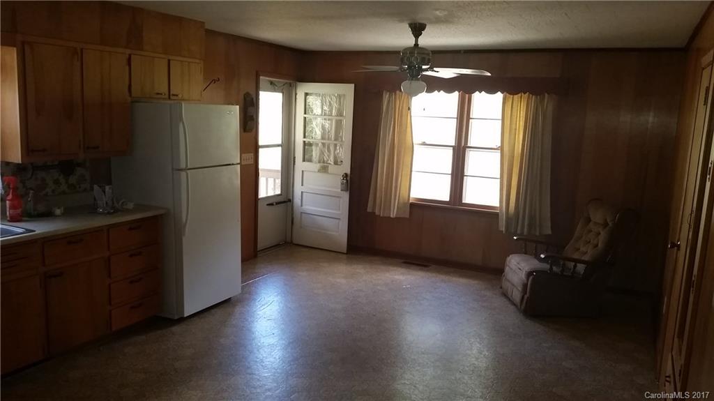 502 Wilson Cove Road Canton, NC 28716 - Photo 18 of 18 a kitchen with refrigerator and window
