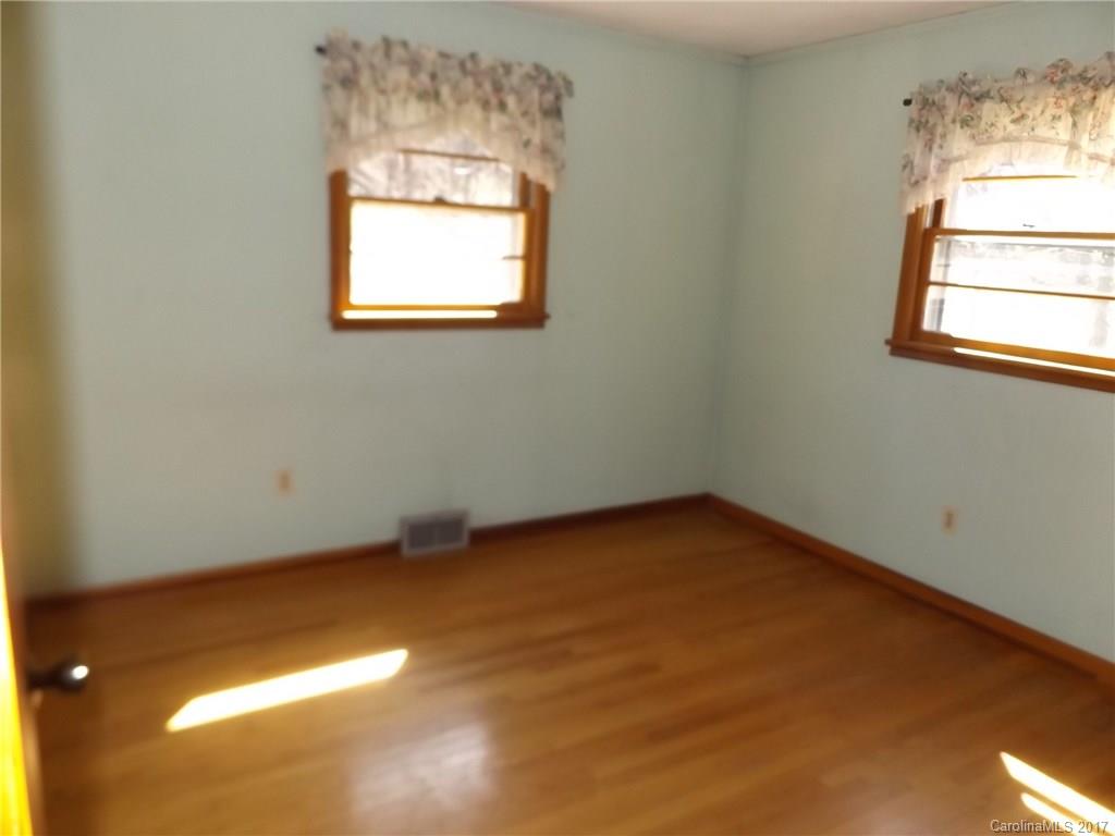 502 Wilson Cove Road Canton, NC 28716 - Photo 5 of 18 an empty room with a window