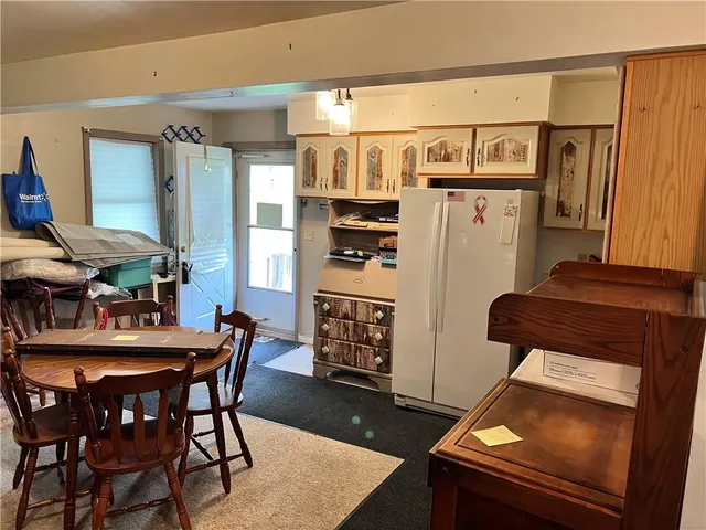 a view of a dining room with furniture and window