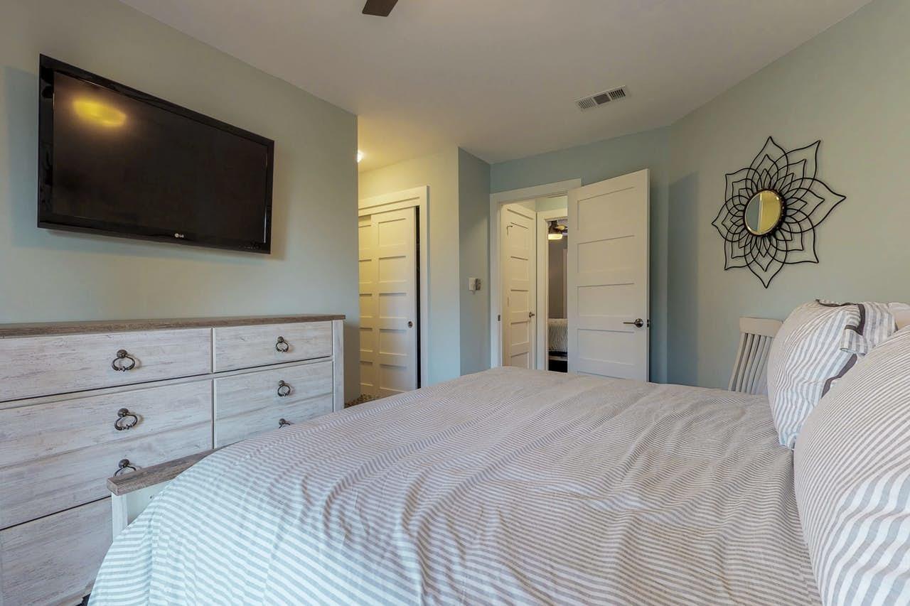 3799 East County Highway 30A, Unit F13 Santa Rosa Beach, FL 32459 - Photo 11 of 30 a bedroom with a bed a flat screen tv and a dresser