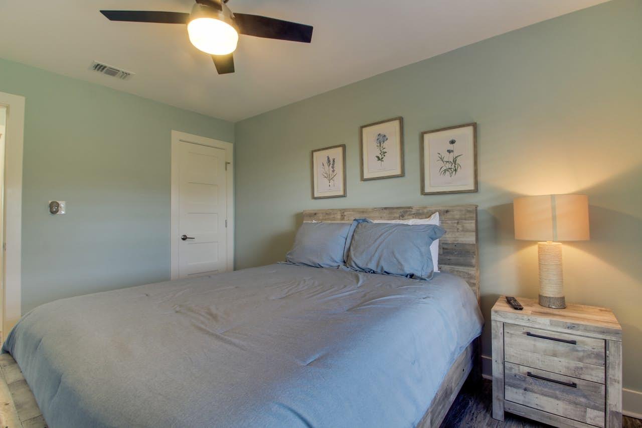 3799 East County Highway 30A, Unit F13 Santa Rosa Beach, FL 32459 - Photo 16 of 30 a bedroom with a bed and a lamp