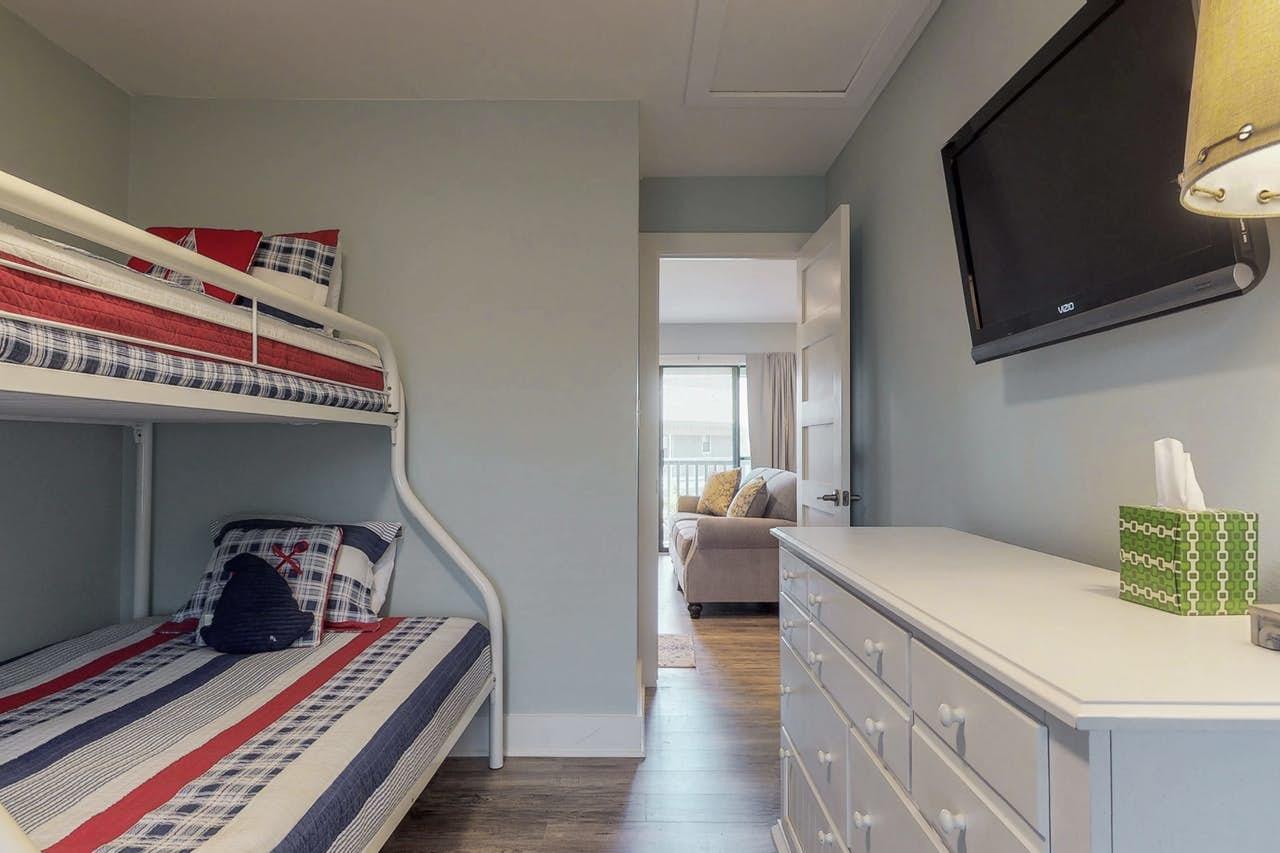 3799 East County Highway 30A, Unit F13 Santa Rosa Beach, FL 32459 - Photo 19 of 30 a bedroom with furniture and a flat screen tv
