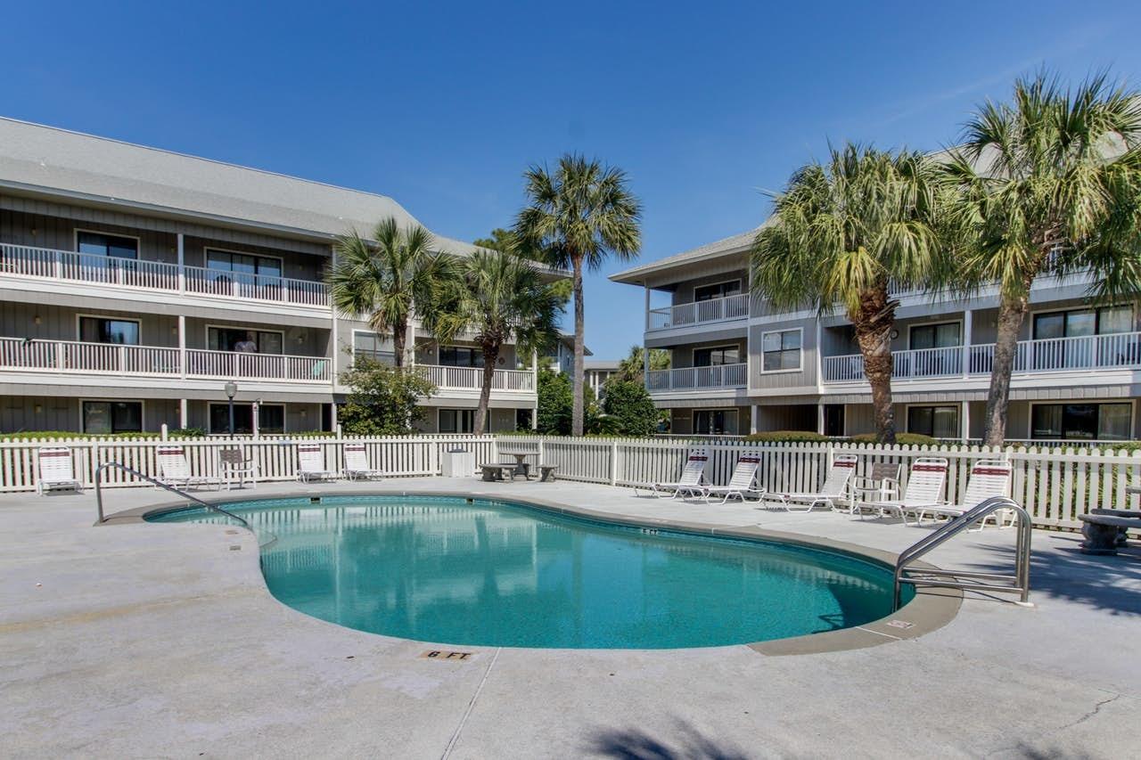3799 East County Highway 30A, Unit F13 Santa Rosa Beach, FL 32459 - Photo 22 of 30 a view of a house with swimming pool and porch