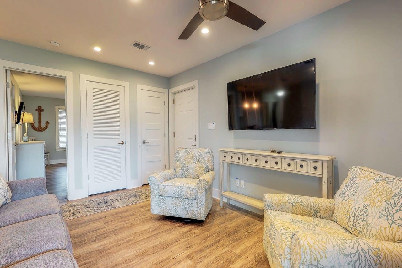 3799 East County Highway 30A, Unit F13 Santa Rosa Beach, FL 32459 - Photo 3 of 30 a living room with furniture and a flat screen tv