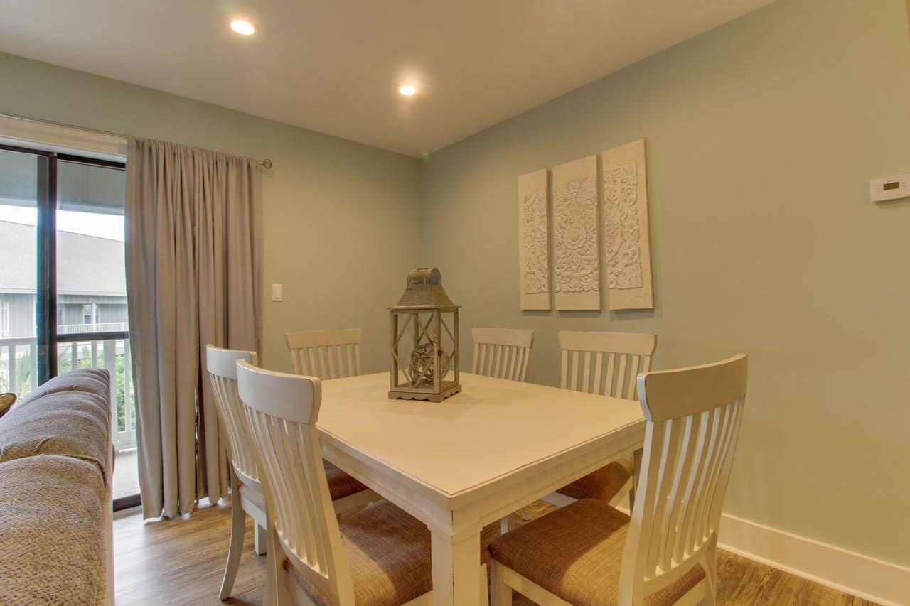 3799 East County Highway 30A, Unit F13 Santa Rosa Beach, FL 32459 - Photo 7 of 30 a view of a dining room with furniture window and wooden floor