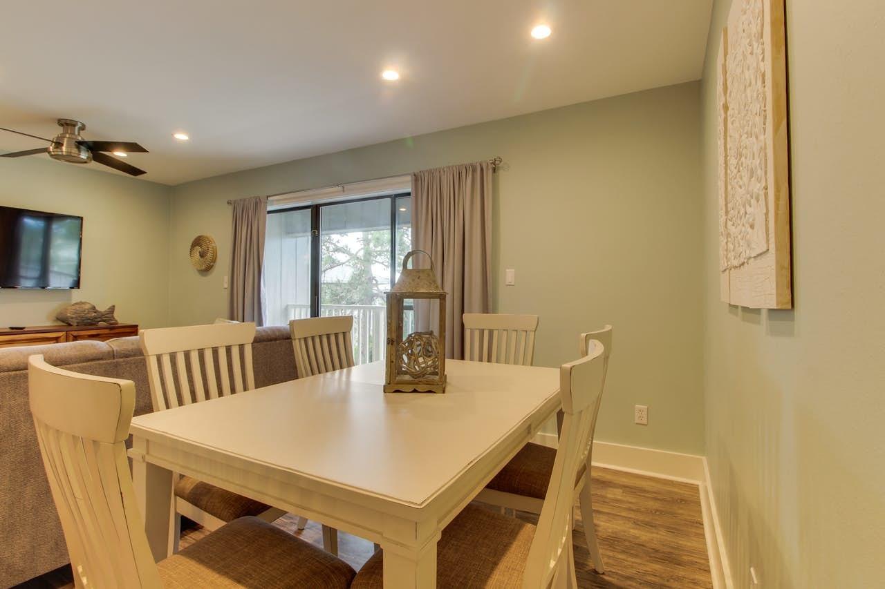 3799 East County Highway 30A, Unit F13 Santa Rosa Beach, FL 32459 - Photo 8 of 30 a view of a dining room with furniture and wooden floor