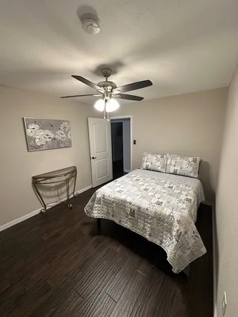 a bedroom with a bed and a table