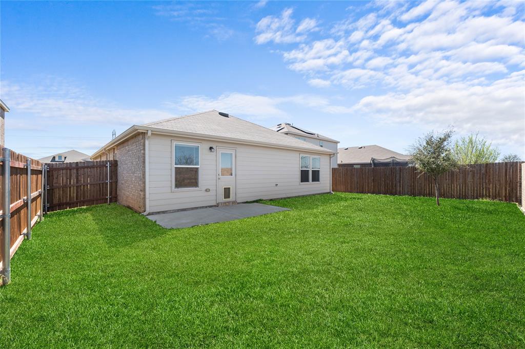 4432 Sagecroft Road Fort Worth, TX 76036 - Photo 15 of 16 Rear view of house with a patio area, a fenced backyard, and brick siding