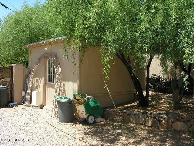 407 Camino Osito Rio Rico, AZ 85648 - Photo 18 of 23 a front view of a house with garden